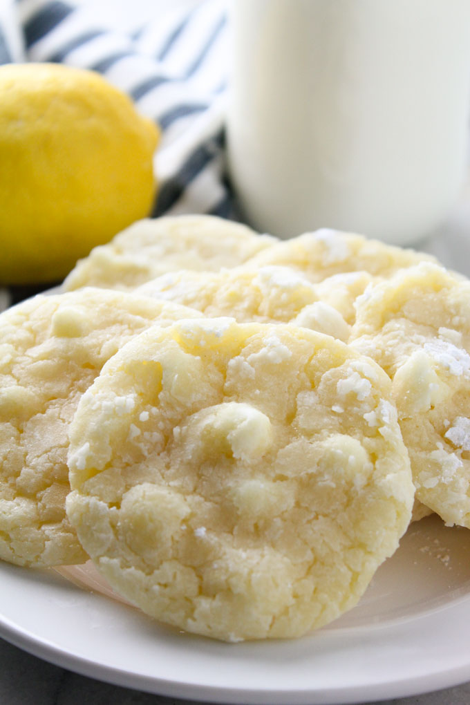 Lemon Crinkle Cookies- a classic chewy lemon cookie made with fresh lemon juice & zest. Plus white chocolate chips!