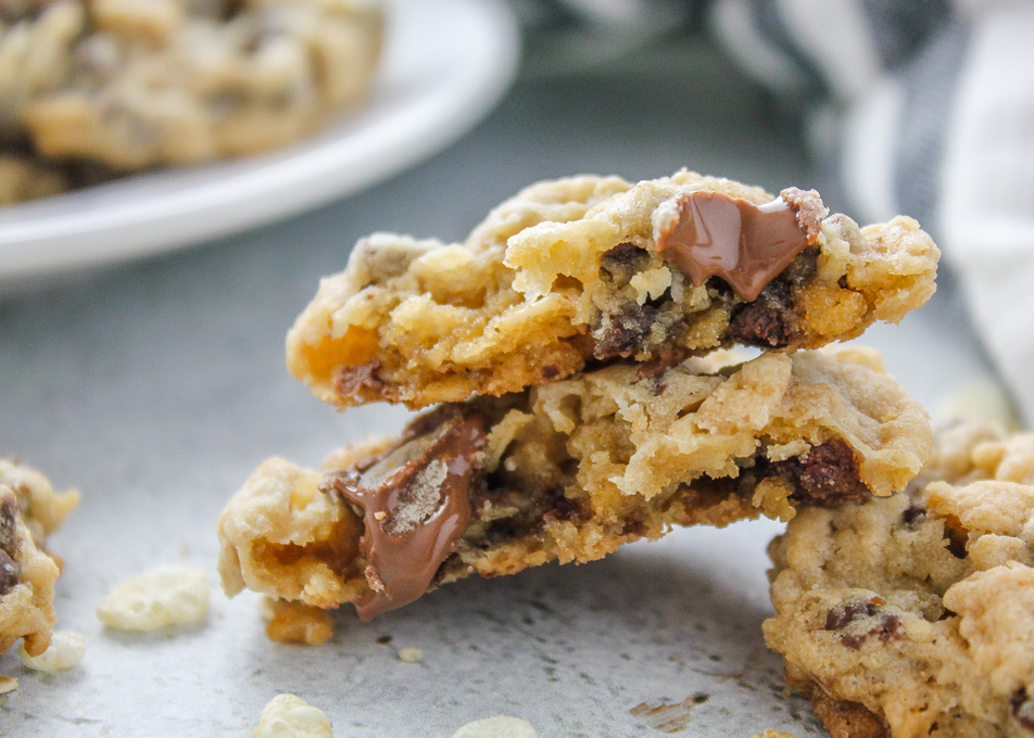 Texas Ranger Cookies-chocolate chip, oatmeal, rice cereal & coconut! These are filled with lots of good stuff. Easy & delish! via bakedinaz.com #cookie #texascookierecipe #chocolatechipcookie #coconutcookies #dessert